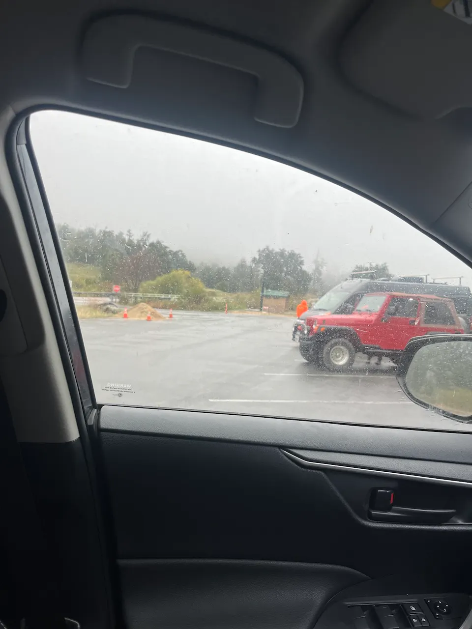 A misty and rainy view through a car window