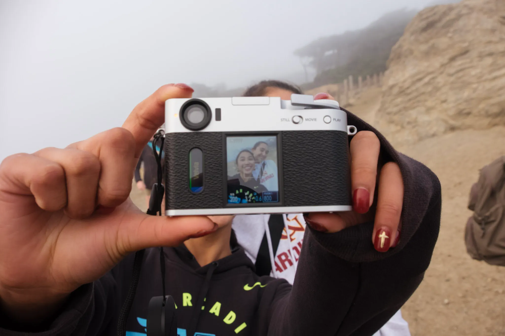 A photographer with their camera