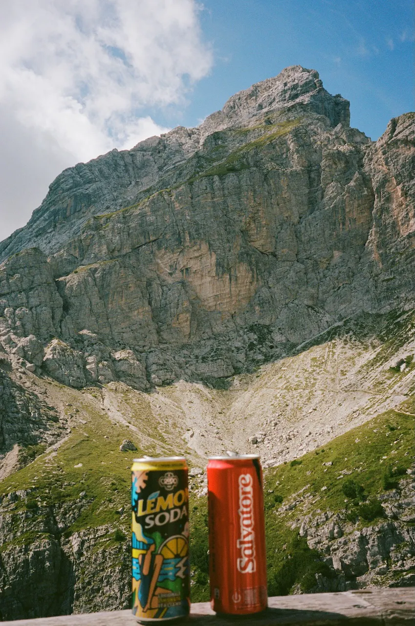 Two soda cans overlooking an epic thru-hike view.