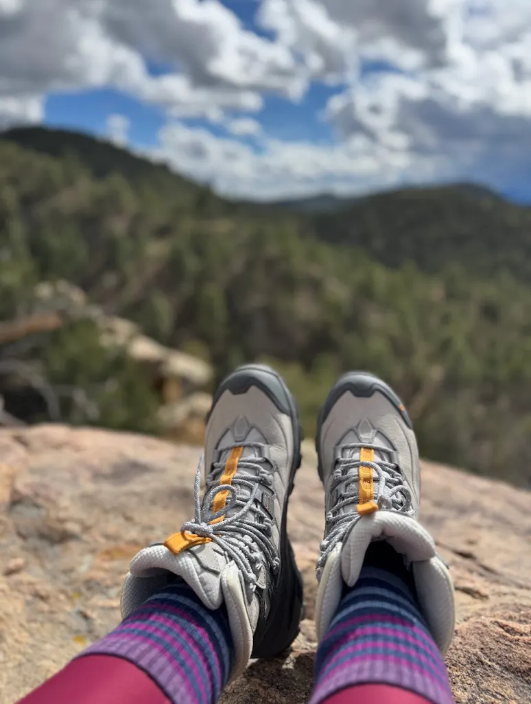 Oboz Hiking Shoes overlooking a forested view