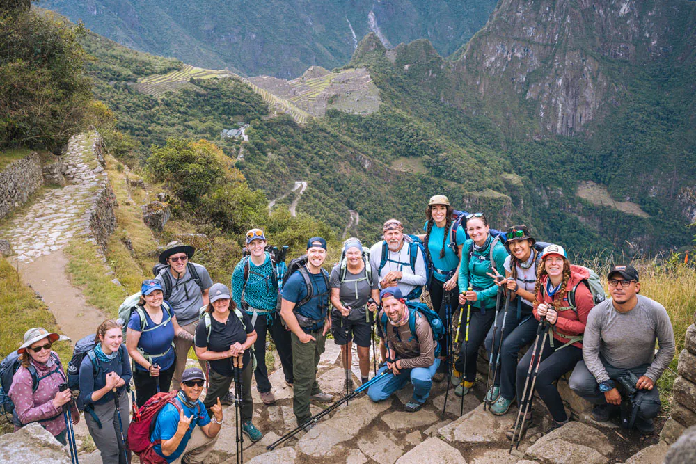A hiking group wearing Oboz footwear after a big day on the trail heading to Machu Picchu