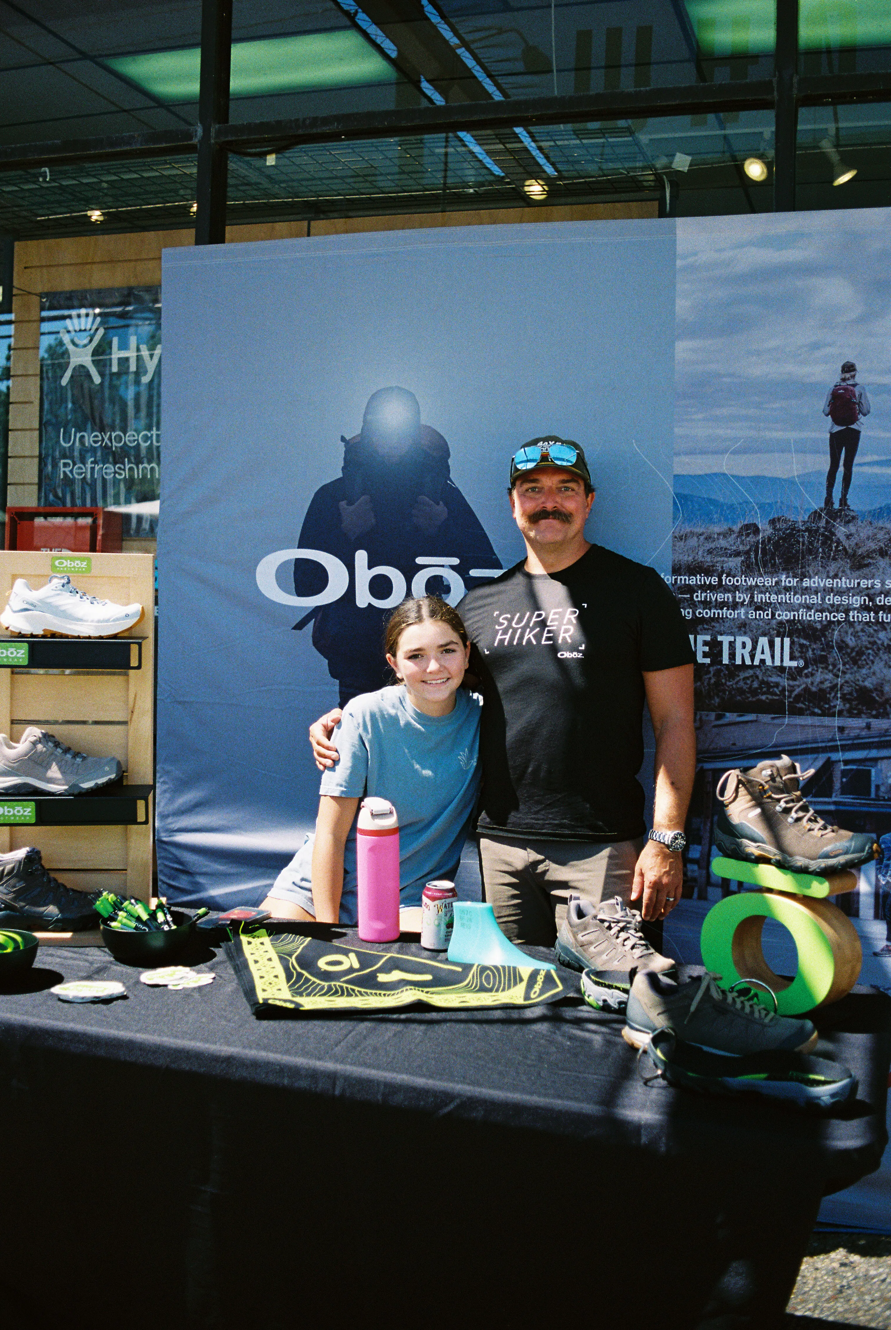 Two employees at an Oboz Footwear booth