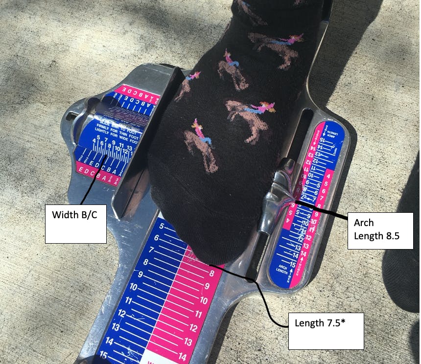 Here, the Brannock device measures this woman's foot length at 7.5 , arch length at 8.5, and foot width at B/C.