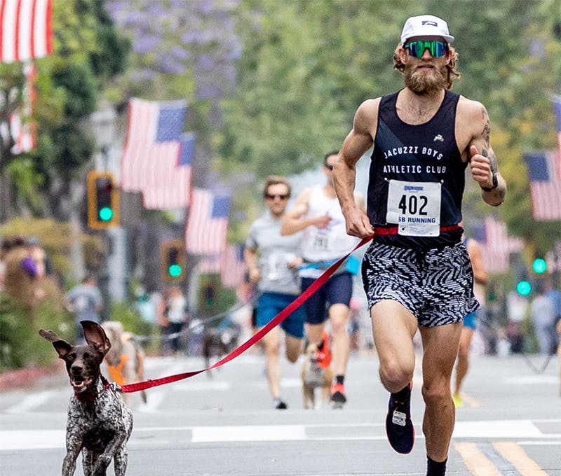 Dan Wehunt running with his dog in a race