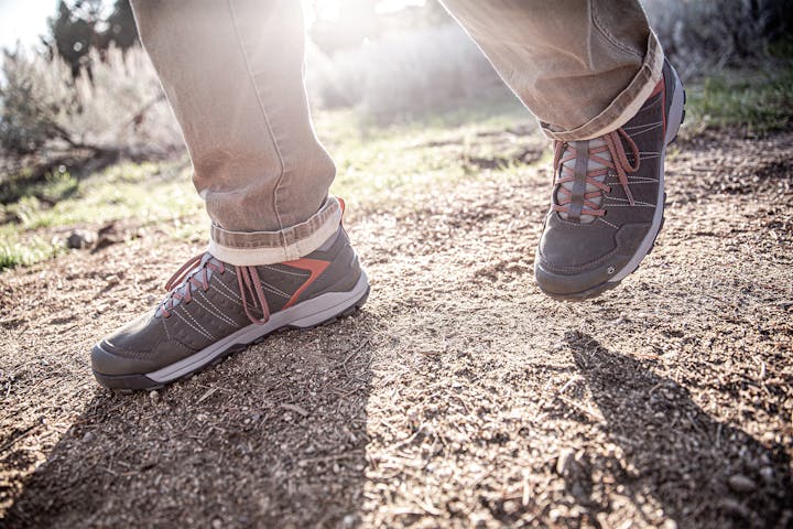 Oboz Sypes Low hiking shoe on foot in the wilderness.