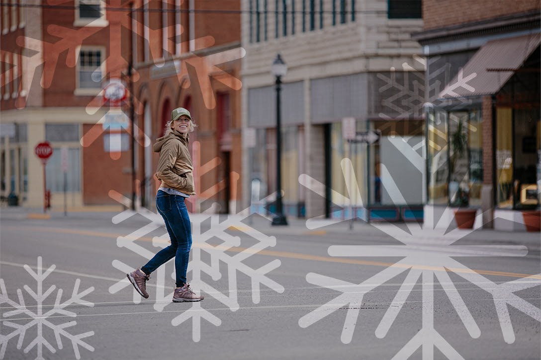 Woman walking in town wearing Oboz Sypes hiking boots
