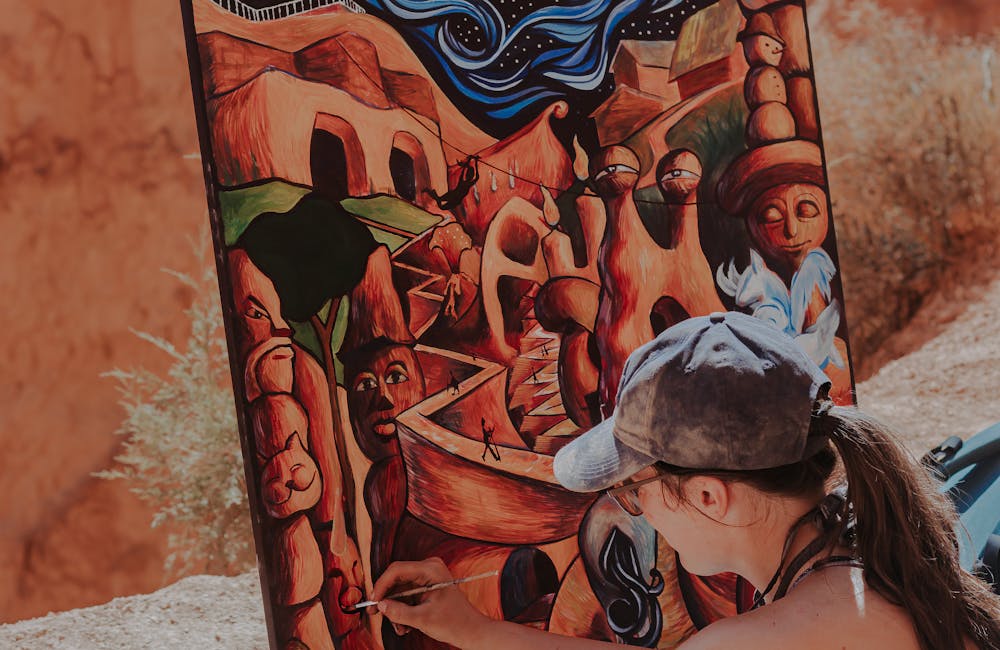 Woman painting a canvas in Bryce Canyon National Park.