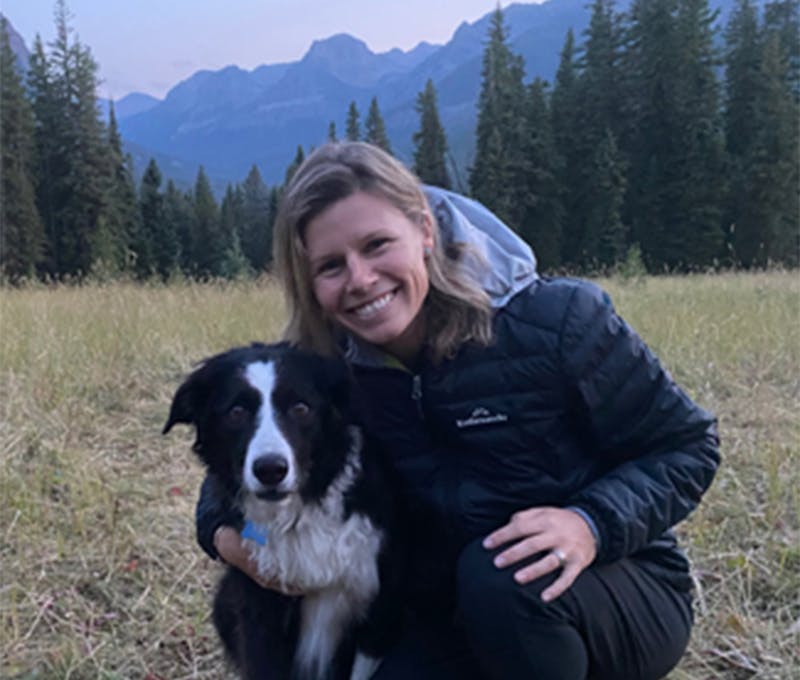 Julie Ham enjoying time outside with her dog