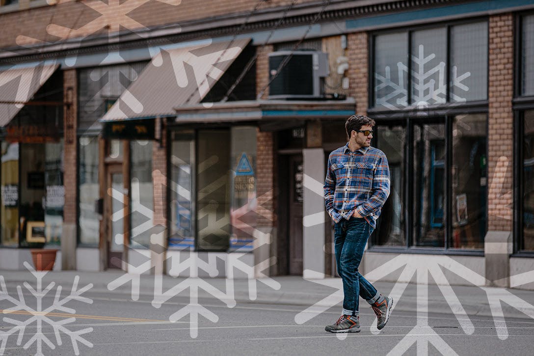 Man walking in town wearing Oboz Sypes hiking boots