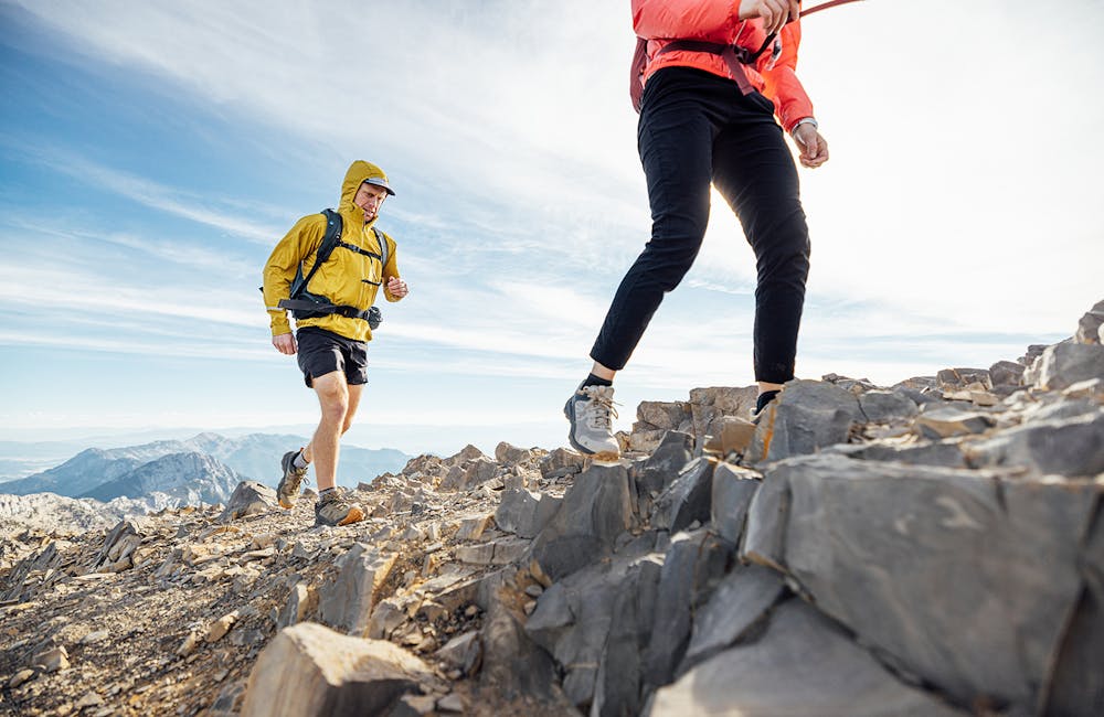 Hikers on mountain ridge wearing Oboz Katabatic hiking shoes