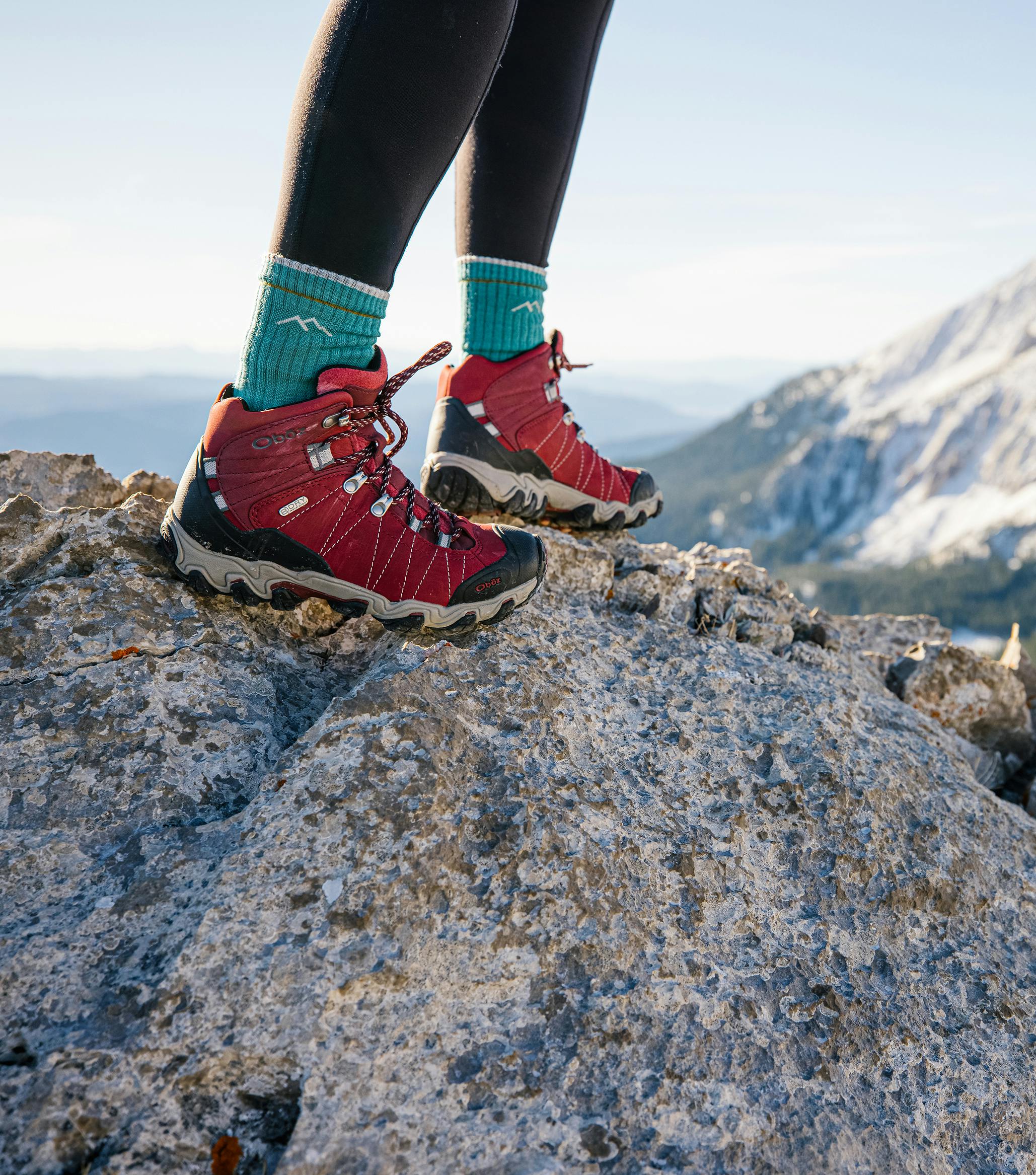 Hiker standing on rock in the Rio Red Bridger Mid Waterproof hiking boots