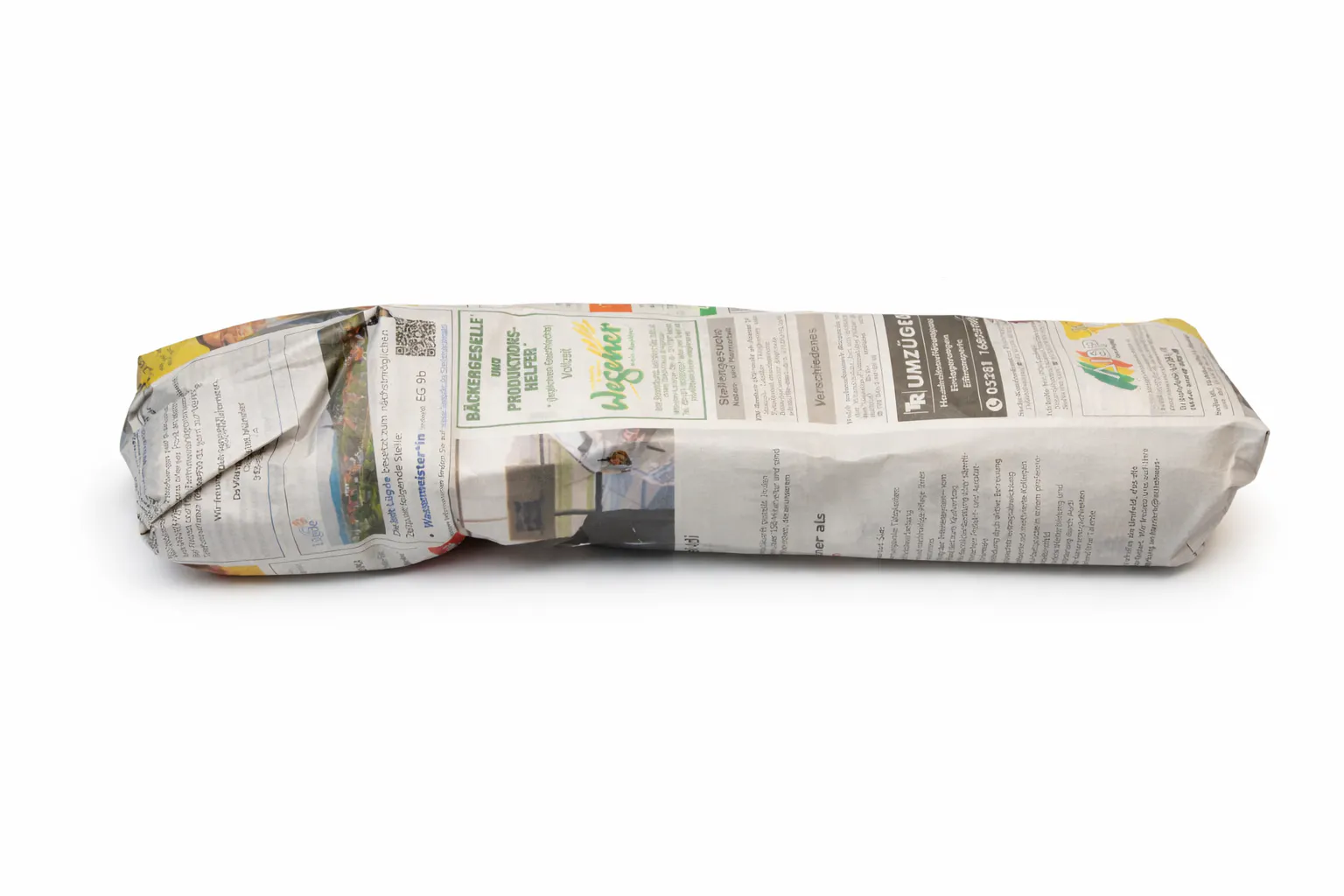 Reiserbündel in Zeitungspapier eingerollt