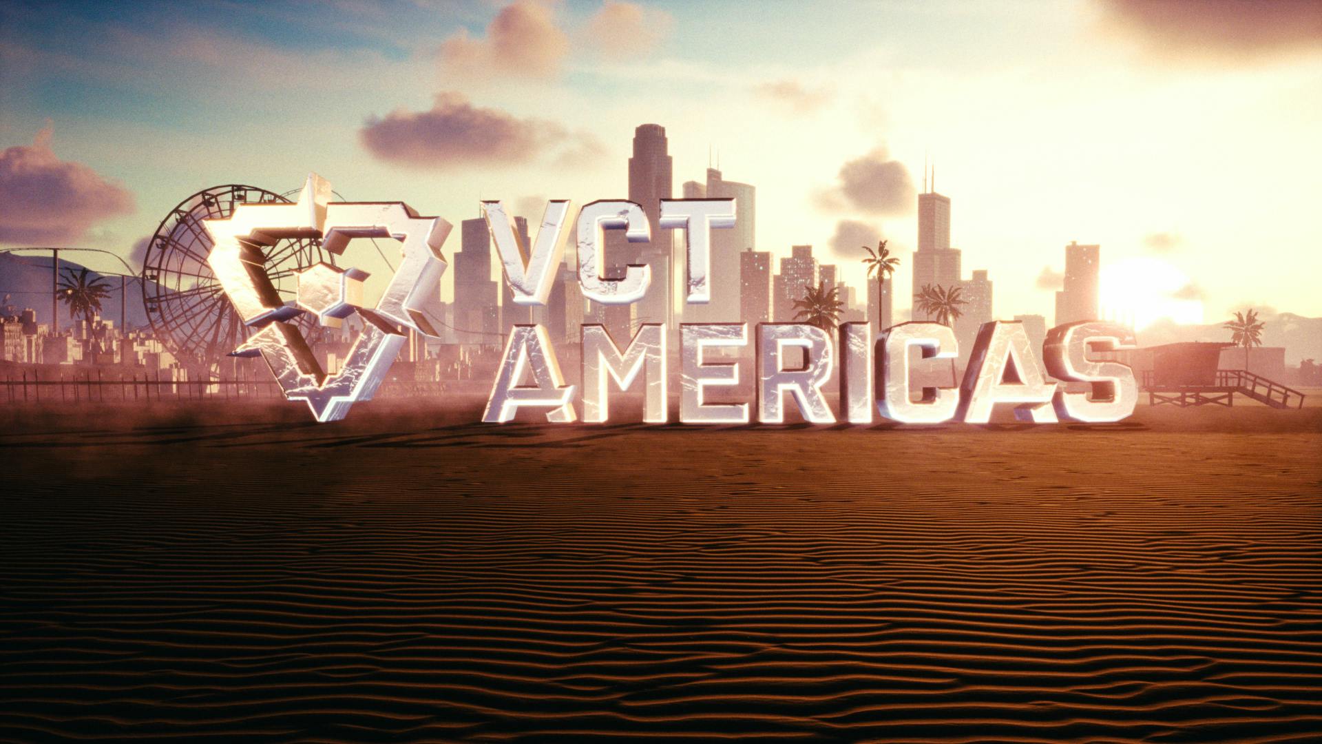 The image showcases the 'VCT AMERICAS' logo, representing the Valorant Champions Tour for the Americas region by Riot Games, set against a stylized Los Angeles backdrop. The metallic, three-dimensional logo is bathed in the warm glow of a setting or rising sun, casting long shadows over the rippled sand. Landmarks like a Ferris wheel and palm trees are silhouetted against the illuminated city skyline, capturing the essence of LA's coastal landscape and the competitive spirit of the gaming event.