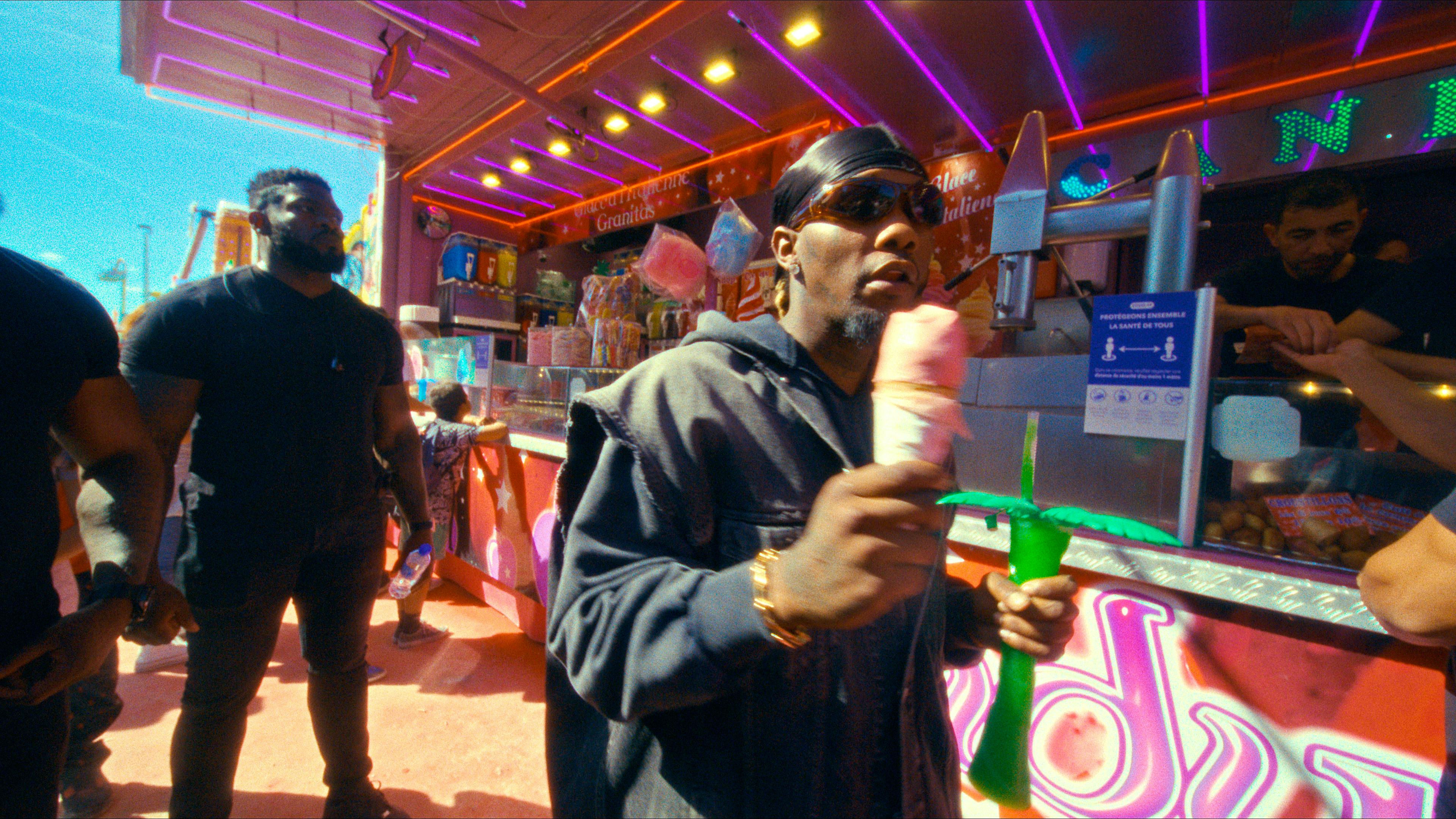 Offset holding an icecream at a fair