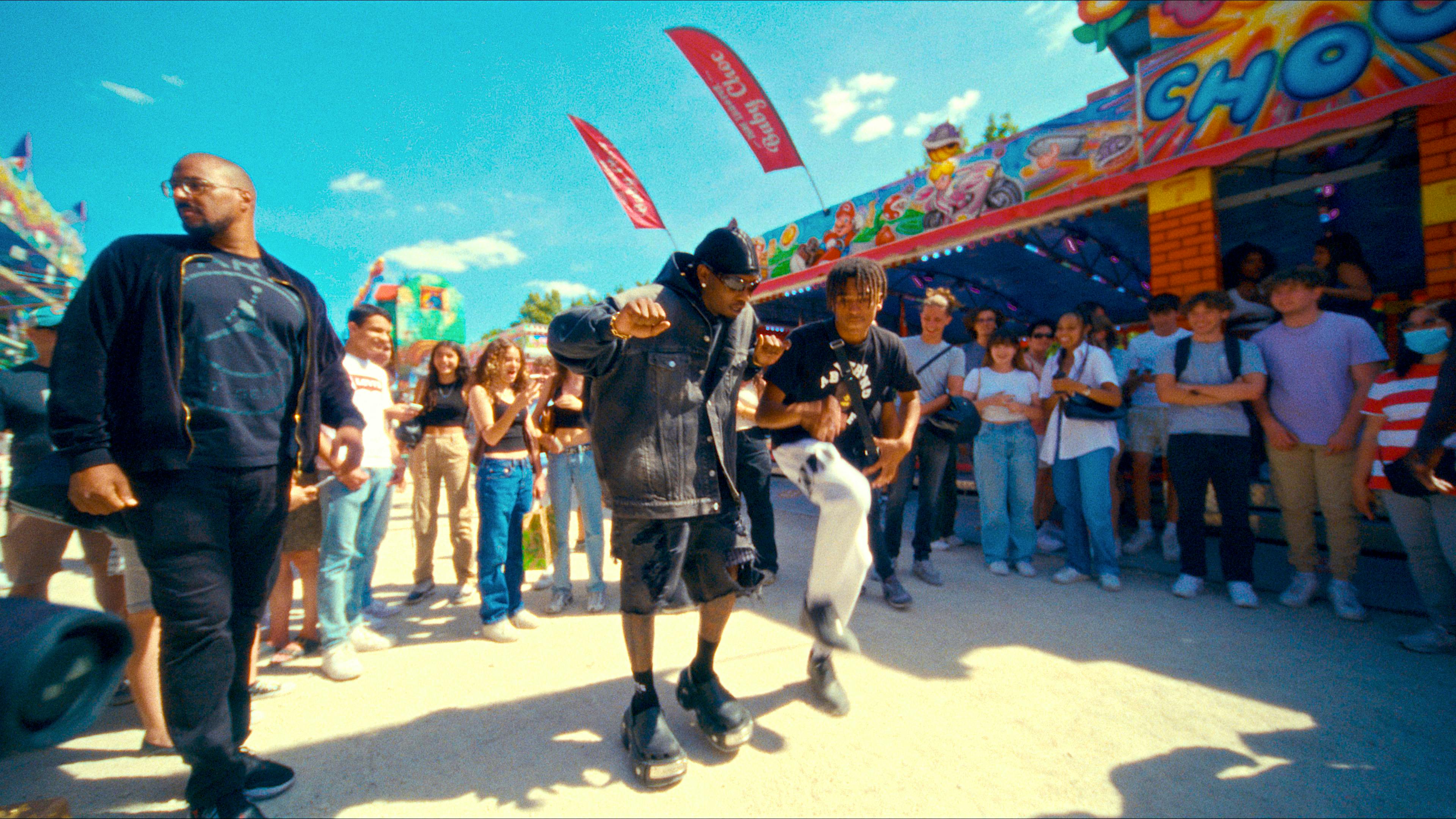 Offset dancing with a fan at a fair