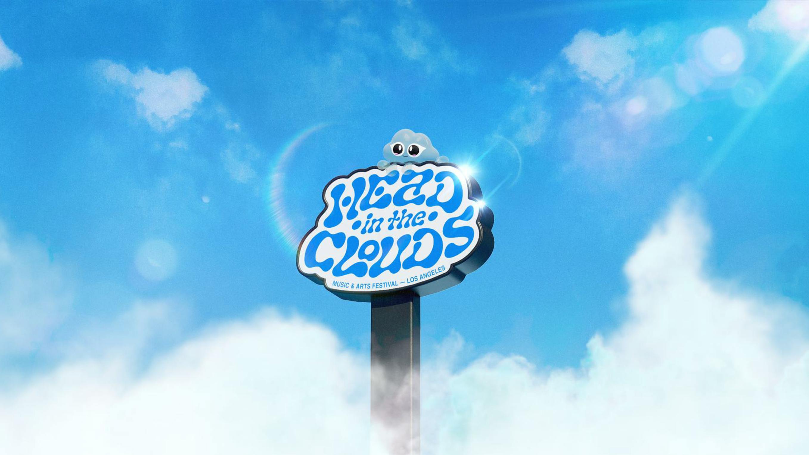 A whimsical promotional image for the Head In The Clouds Music & Arts Festival in Los Angeles, showcasing a clear blue sky with fluffy white clouds. At the center is a stylized sign resembling a cloud, with the text 'Head in the Clouds' in a playful, bold blue font. On top of the cloud sign sits the festival's mascot, Clo The Cloud God, a cute animated cloud character with wide eyes. Sunlight flares gently into the frame, creating a dreamy and inviting atmosphere that captures the essence of the festival's name and theme.
