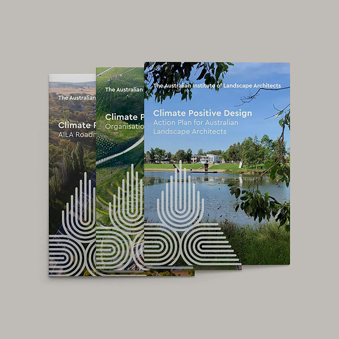 An image of three report covers about climate positive design featuring photos of landscapes.