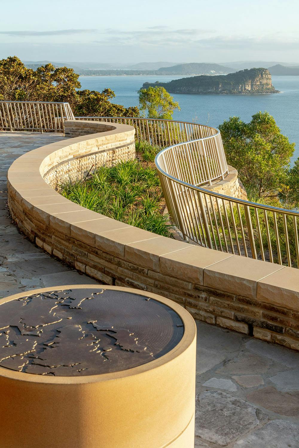 A photograph of a map on a sandstone plinth.