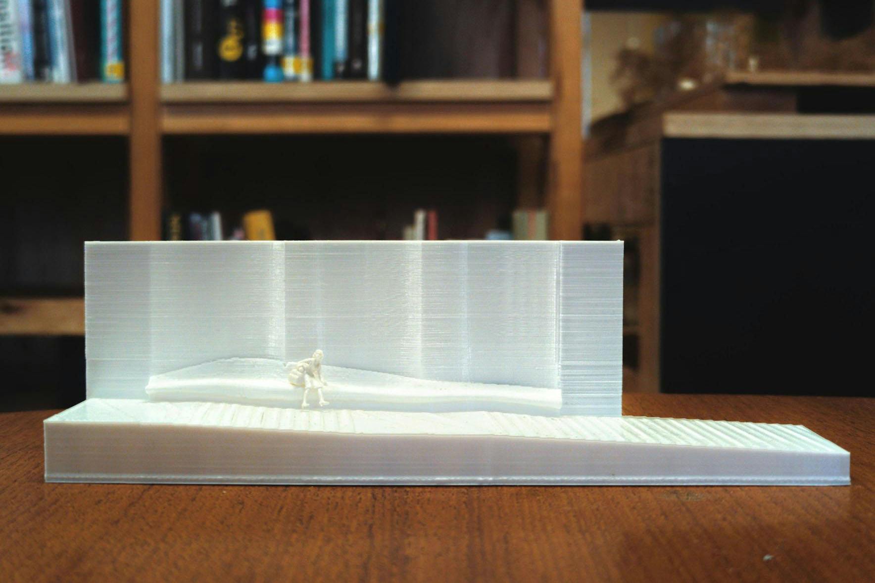 A white, 3D printed architectural model. 