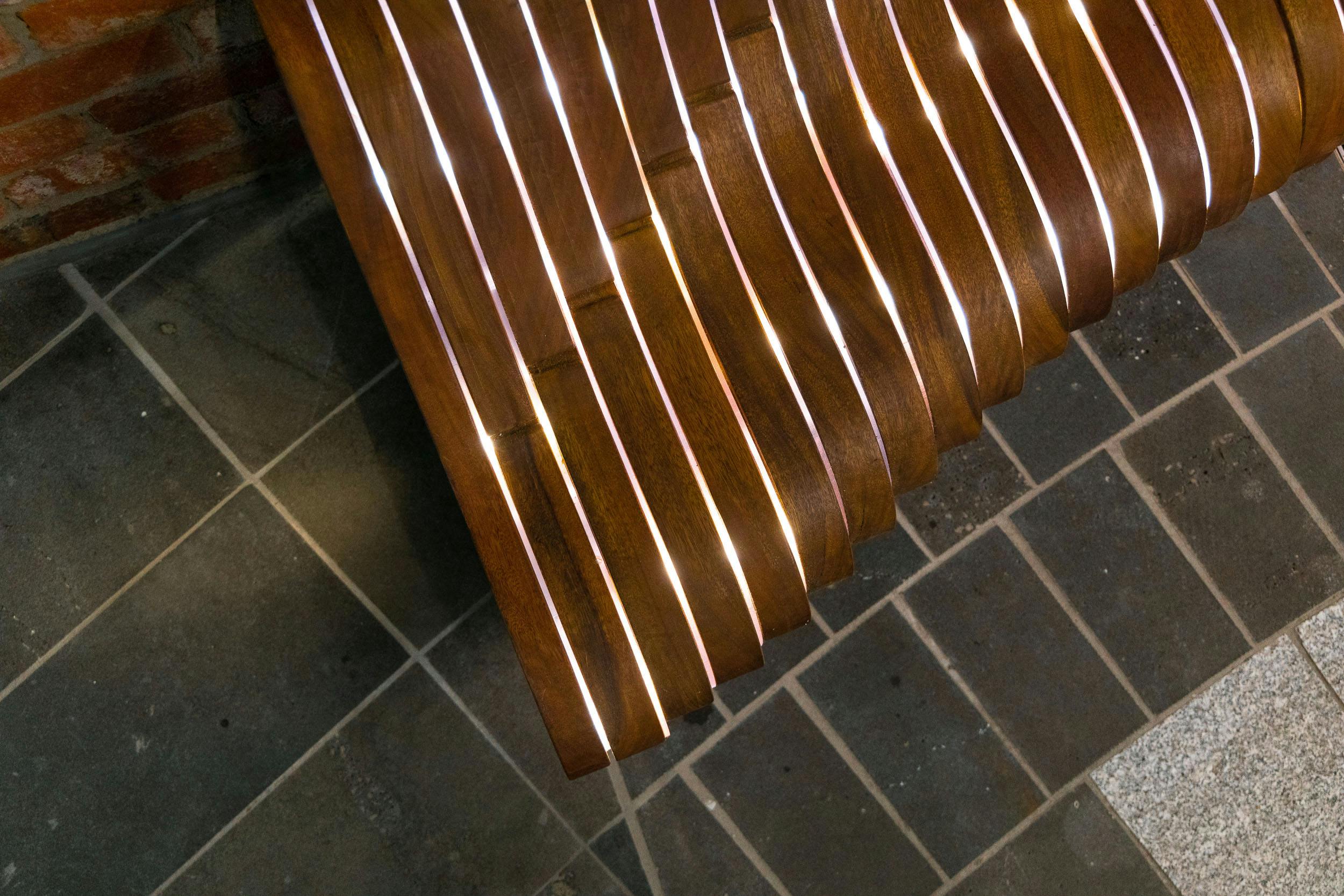 A photograph of a glowing wooden bench.