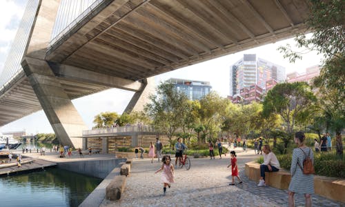 A digital render of a waterfront park filled with trees and people. The park is under a large concrete bridge, and a boat shed with ramp is visible. 