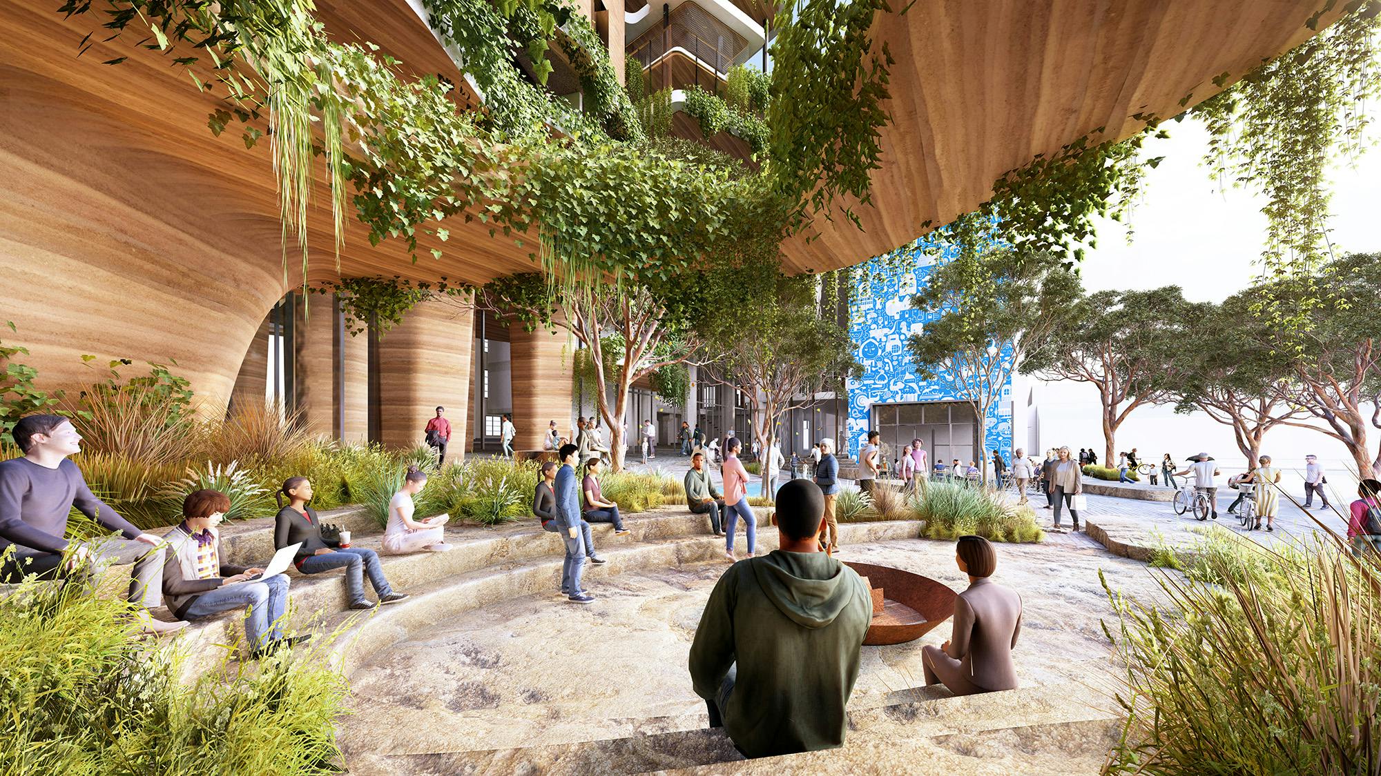 A digital render of people gathering in a semi-enclosed, round, courtyard-like, outdoor space. There are grassy plants in the foreground, hanging plants above, and trees seen in the distance. 