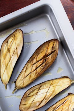 baked aubergines on a baking tray 