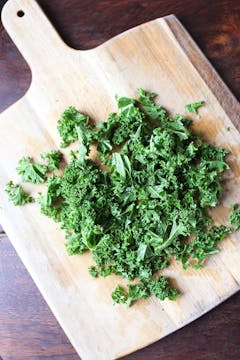 chopped kale on chopping board