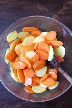Potatoes and carrots in mixing bowl