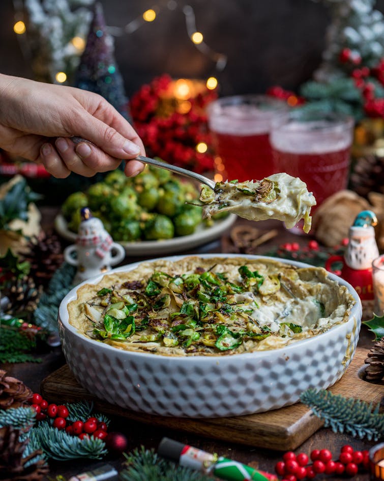 Christmas decoration, food and Brussels Sprouts & Potato Dauphinoise on a oven dish
