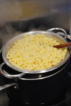 Macaroni cooking in boiling salted water. 