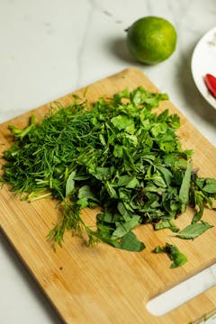 Chopped herbs to be used in this herby Thai noodle salad.