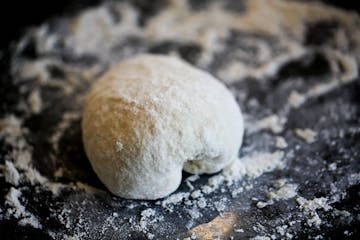 pizza dough on a floured board