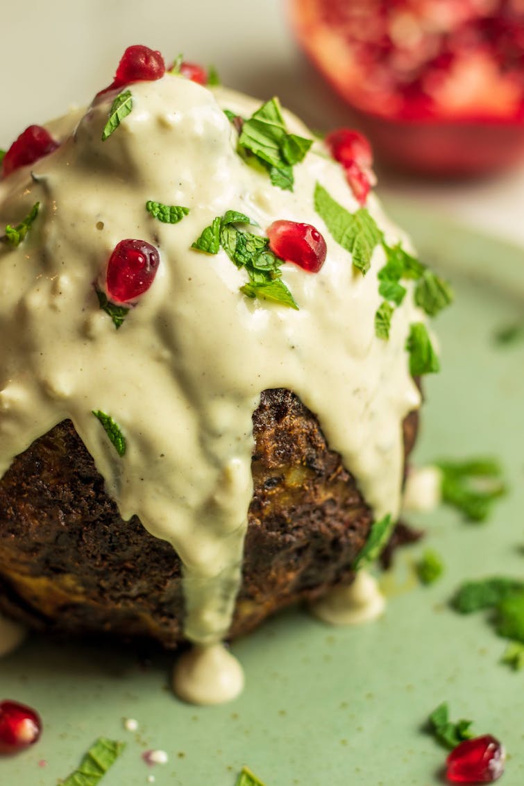 Celeriac Shawarma topped with Pomegranate, Mint & Tahini Dressing