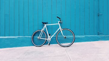a bike against blue fence