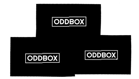 Three Oddbox boxes stacked in a pyramid