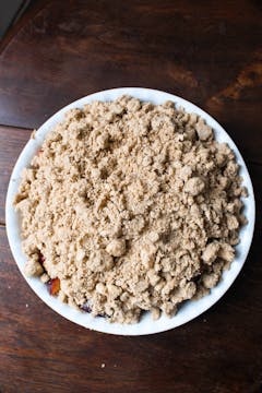 crumble over the fruit in pie dish