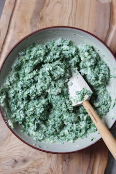 Kale stems mixed into the bechamel sauce. 