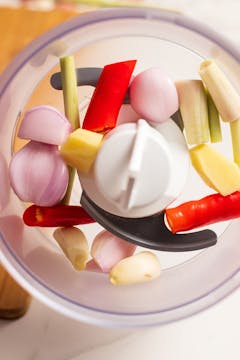 in a food processor,white part of lemongrass, shallot, peeled ginger and garlic