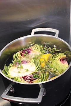 artichokes in a sauce pan ready to boil