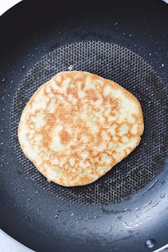 image of other side of blini in pan