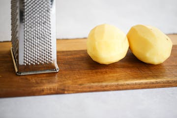 image of potatoes and a grater