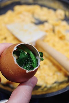 stuffed egg shell with scrambled egg and spinach