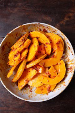 Butternut and harissa mixture in large mixing bowl