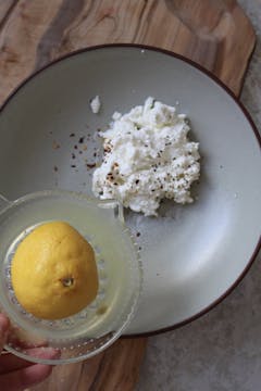 image of ricotta with lemon juice, salt, pepper and chilli flakes