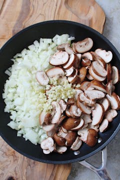 Mushroom, garlic and onion in a frying pan