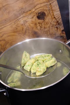 gnocchi in saucepan with water 