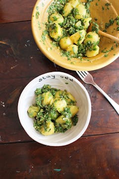 served potato salad on a bowl