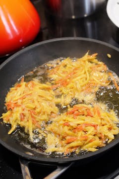 carrots cooking in frying pan