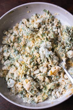 gnocchi dough mixture in mixing bowl with fork